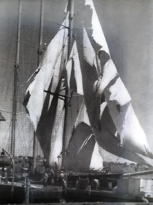 The schooner Atlantic at the dock of the U.S. Coast Guard Academy showing condition of sails after a hurricane, 1946.