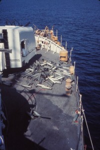 Deck litter during naval gunfire support mission, USCGC PONTCHARTRAIN, Vietnam, 1970. Photo by LeRoy Reinburg, Jr.